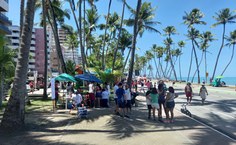 Ação do projeto na orla (Divulgação)