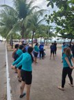 Grupo participou de alongamento antes de remar na praia da Pajuçara